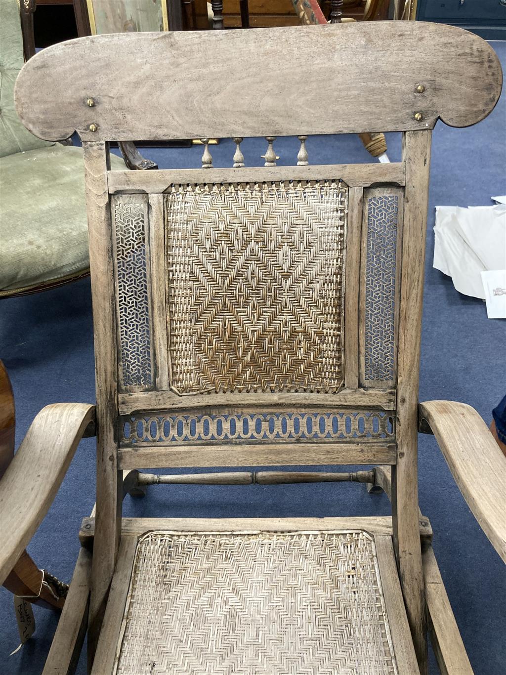 An Anglo Indian caned bleached hardwood steamer chair